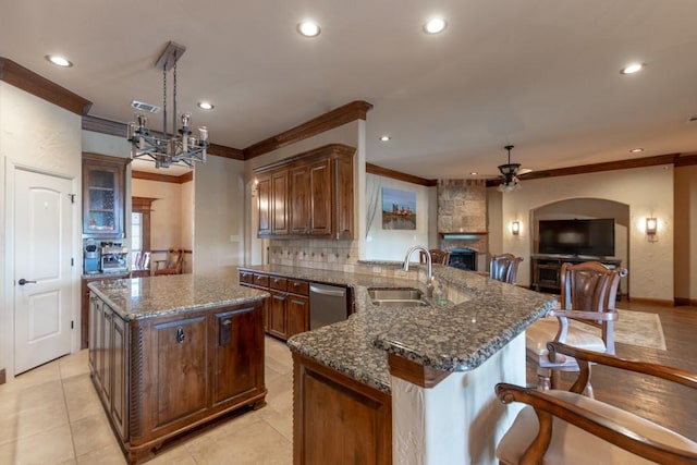 1235 Meredith Creek Ln, Fort Worth, TX 76179 - kitchen featuring crown molding, ceiling fan, a sink, a peninsula, and recessed lighting