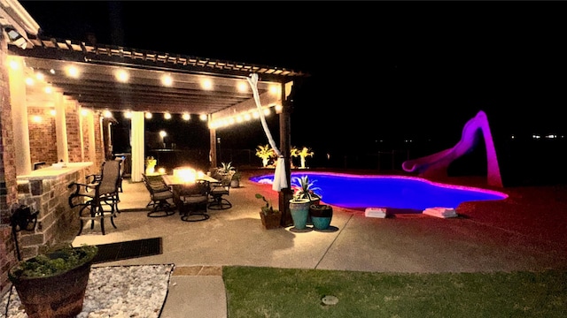 1235 Meredith Creek Ln, Fort Worth, TX 76179 - patio at twilight with a pergola, a patio, an outdoor pool, and a fire pit