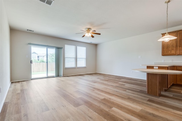 5132 Senator Dr, Fort Worth, TX 76244 - unfurnished living room featuring ceiling fan, light wood finished floors, and baseboards
