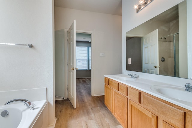 5132 Senator Dr, Fort Worth, TX 76244 - full bath with a stall shower, wood finished floors, a bath, and double vanity
