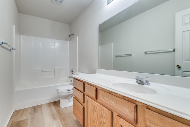 5132 Senator Dr, Fort Worth, TX 76244 - bathroom with toilet, vanity, tub / shower combination, and wood finished floors