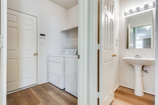 5132 Senator Dr, Fort Worth, TX 76244 - washroom with separate washer and dryer, light wood finished floors, and baseboards