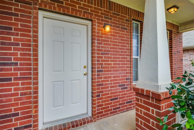 5132 Senator Dr, Fort Worth, TX 76244 - view of exterior entry with brick siding and a porch