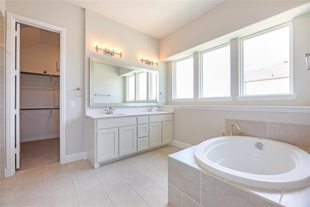2207 Morris St, Rockwall, TX 75087 - full bath with a bath, double vanity, tile patterned floors, baseboards, and a spacious closet