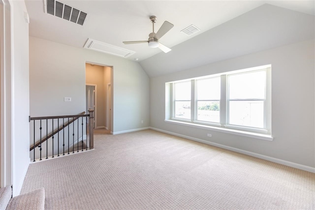2207 Morris St, Rockwall, TX 75087 - spare room featuring vaulted ceiling, attic access, carpet, ceiling fan, and baseboards