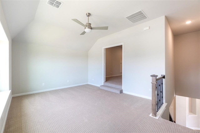 2207 Morris St, Rockwall, TX 75087 - spare room with light colored carpet, lofted ceiling, a ceiling fan, and baseboards