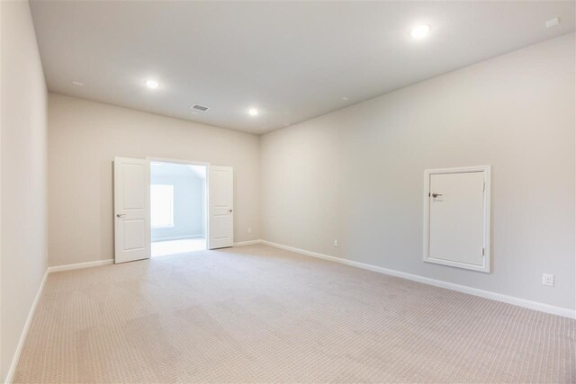 2207 Morris St, Rockwall, TX 75087 - unfurnished room featuring light colored carpet, baseboards, and recessed lighting