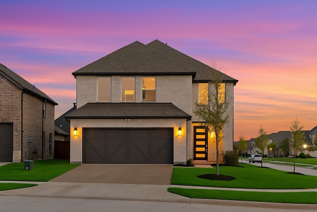 929 Lady Tessala Ave, Lewisville, TX 75056 - view of front of property featuring a garage, brick siding, concrete driveway, and a lawn