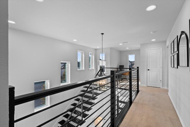 929 Lady Tessala Ave, Lewisville, TX 75056 - hall with an upstairs landing, light colored carpet, recessed lighting, and baseboards