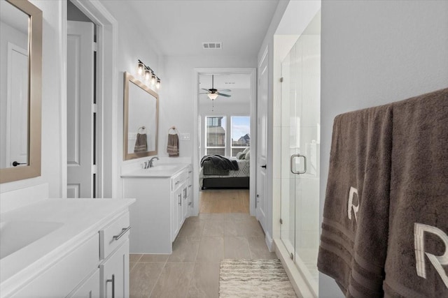 929 Lady Tessala Ave, Lewisville, TX 75056 - ensuite bathroom with two vanities, a stall shower, and ceiling fan