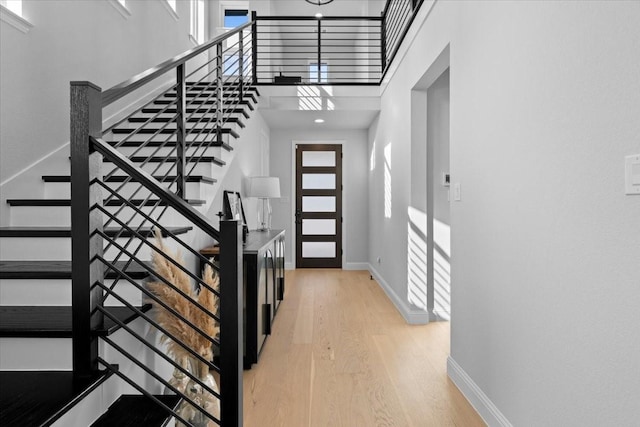 929 Lady Tessala Ave, Lewisville, TX 75056 - entryway featuring wood finished floors, stairs, a high ceiling, and baseboards