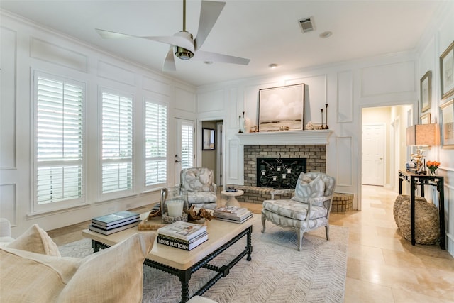 6305 Crested Butte Dr, Dallas, TX 75252 - living room featuring a decorative wall, ornamental molding, ceiling fan, and a brick fireplace