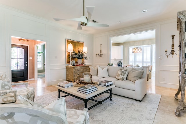 6305 Crested Butte Dr, Dallas, TX 75252 - living area featuring a decorative wall, a chandelier, ornamental molding, and ceiling fan