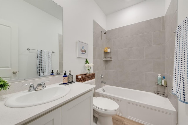968 Manuel Dr, Fate, TX 75087 - bathroom with toilet, vanity,  shower combination, and wood finished floors