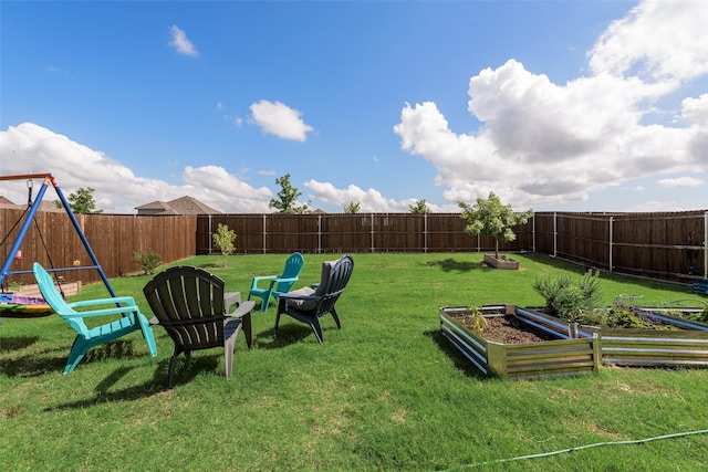 968 Manuel Dr, Fate, TX 75087 - view of yard featuring a vegetable garden and a playground