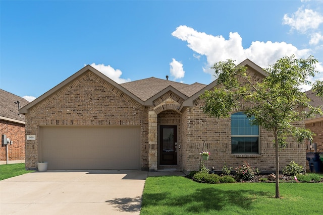 968 Manuel Dr, Fate, TX 75087 - french provincial home with brick siding, concrete driveway, a garage, and a front lawn