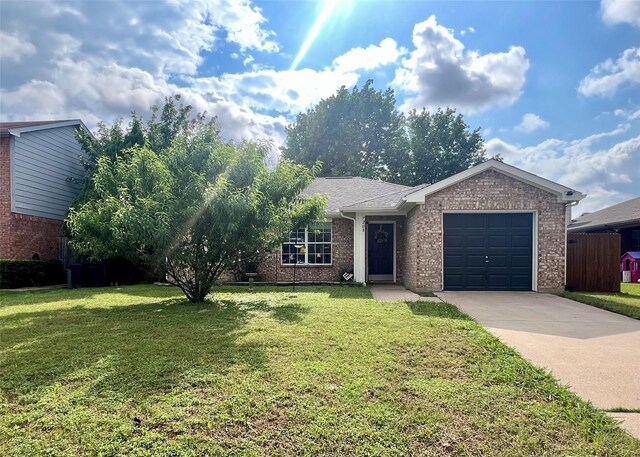7208 Autumn Run Dr, Forest Hill, TX 76140 - view of front of house featuring driveway, a garage, and brick siding