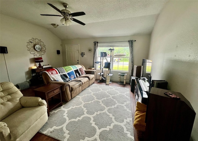 7208 Autumn Run Dr, Forest Hill, TX 76140 - living room with lofted ceiling, ceiling fan, a textured ceiling, and wood finished floors