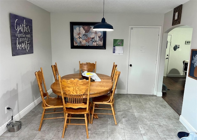 7208 Autumn Run Dr, Forest Hill, TX 76140 - dining space featuring arched walkways and baseboards