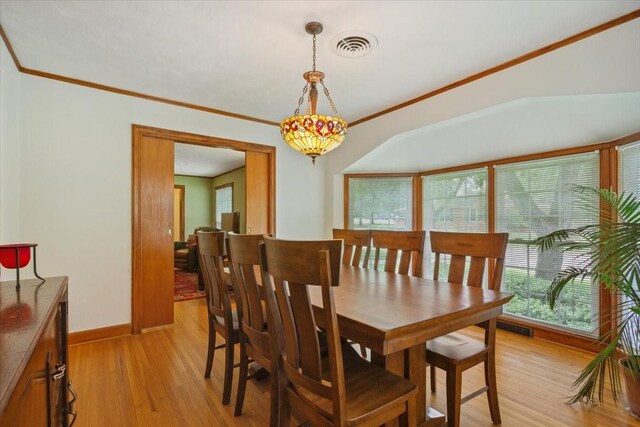 3808 Huaco Ln, Waco, TX 76710 - dining area featuring light wood-style flooring, baseboards, and crown molding