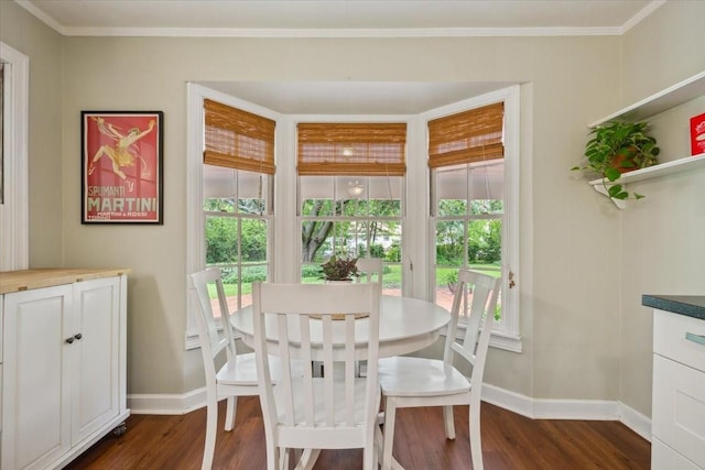 3808 Huaco Ln, Waco, TX 76710 - dining space with dark wood-style flooring, baseboards, and crown molding