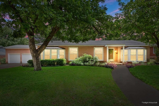 3808 Huaco Ln, Waco, TX 76710 - ranch-style home featuring an attached garage, a yard, and driveway