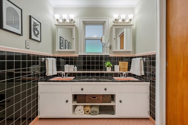 3808 Huaco Ln, Waco, TX 76710 - bathroom featuring ornamental molding, tile walls, double vanity, a chandelier, and tile patterned floors