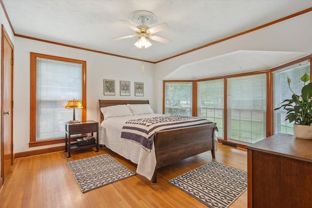 3808 Huaco Ln, Waco, TX 76710 - bedroom featuring light wood-style floors, a ceiling fan, ornamental molding, and baseboards