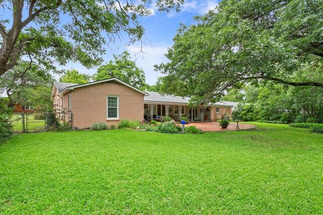 3808 Huaco Ln, Waco, TX 76710 - back of property with brick siding and a patio