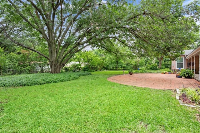 3808 Huaco Ln, Waco, TX 76710 - view of green lawn featuring a patio area