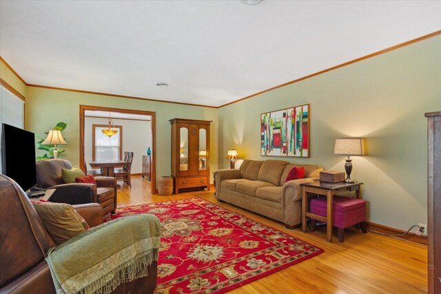 3808 Huaco Ln, Waco, TX 76710 - living area featuring ornamental molding, light wood finished floors, and baseboards