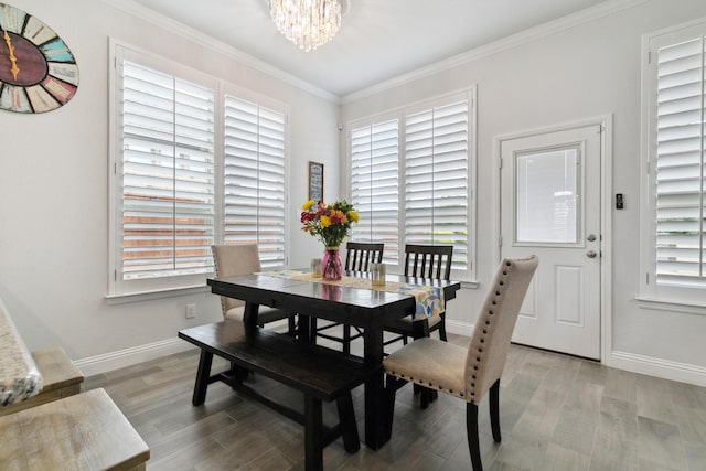15236 Holly Bay Ct, Aledo, TX 76008 - dining area with a chandelier, crown molding, light wood-style floors, and plenty of natural light