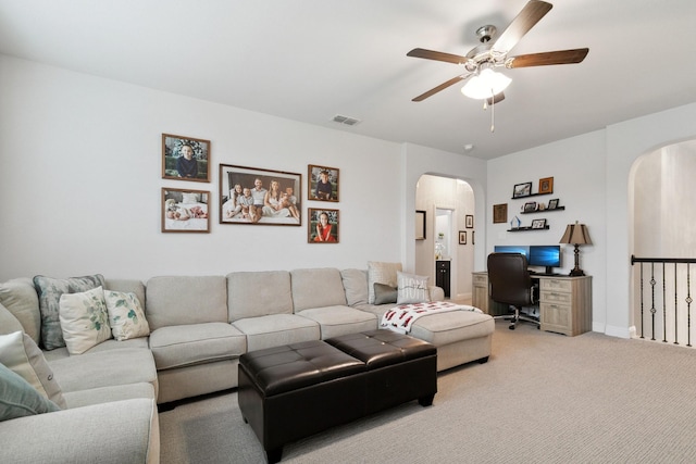 15236 Holly Bay Ct, Aledo, TX 76008 - carpeted living room with arched walkways, ceiling fan, and a desk