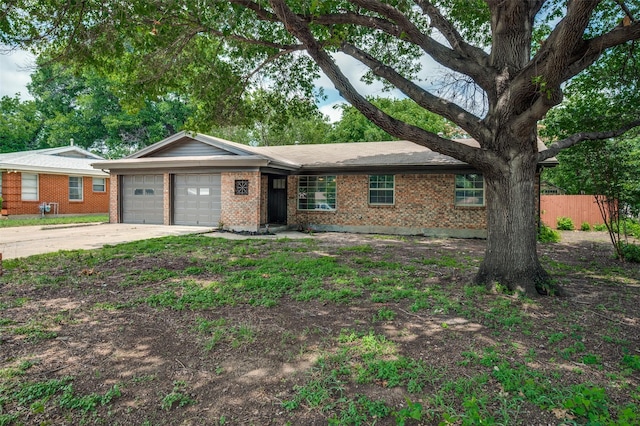 2000 Bettibart St, Fort Worth, TX 76134 - single story home featuring a garage, concrete driveway, and brick siding