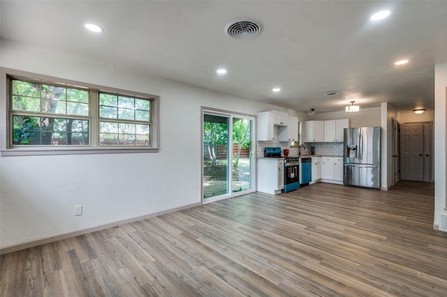 2000 Bettibart St, Fort Worth, TX 76134 - unfurnished living room with wood finished floors and recessed lighting