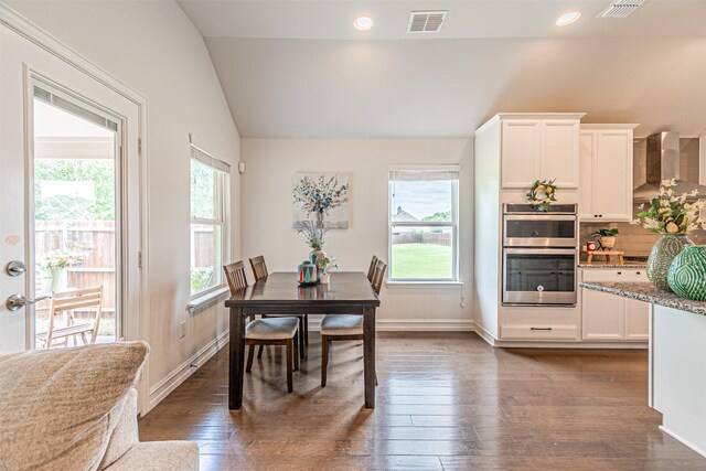 2923 Ash Ave, Melissa, TX 75454 - kitchen with wall chimney range hood, stainless steel appliances, a sink, light wood-style floors, and decorative backsplash