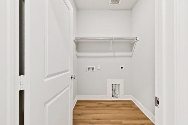 8141 Meadow Valley Dr, Mckinney, TX 75071 - washroom featuring hookup for an electric dryer, washer hookup, wood finished floors, and baseboards
