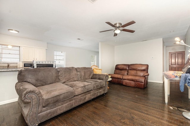 2517 Blanton St, Dallas, TX 75227 - living room with a ceiling fan, dark wood finished floors, and baseboards
