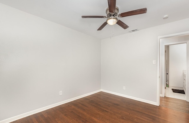 2517 Blanton St, Dallas, TX 75227 - spare room with dark wood-style flooring, baseboards, ceiling fan, and a smoke detector