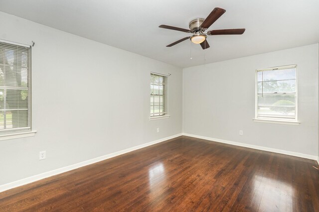 2517 Blanton St, Dallas, TX 75227 - spare room with dark wood-type flooring, baseboards, and ceiling fan