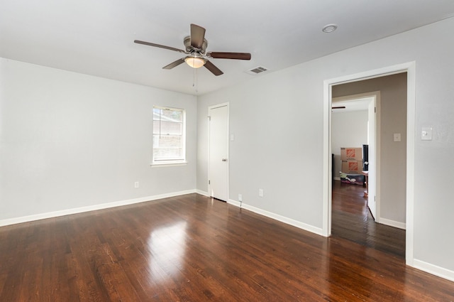 2517 Blanton St, Dallas, TX 75227 - unfurnished room featuring dark wood-type flooring, a ceiling fan, and baseboards