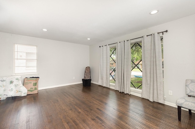2517 Blanton St, Dallas, TX 75227 - unfurnished living room with wood finished floors, baseboards, and recessed lighting
