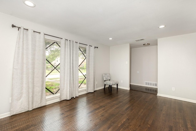 2517 Blanton St, Dallas, TX 75227 - empty room featuring plenty of natural light, wood finished floors, recessed lighting, and baseboards