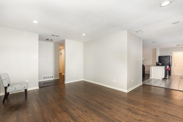 2517 Blanton St, Dallas, TX 75227 - unfurnished living room with wood finished floors, recessed lighting, and baseboards