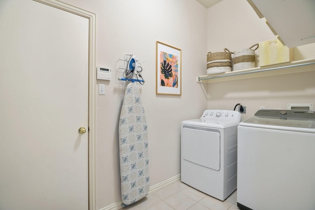 6405 Baycrest Cir, Sachse, TX 75048 - washroom featuring washing machine and clothes dryer, light tile patterned floors, and baseboards
