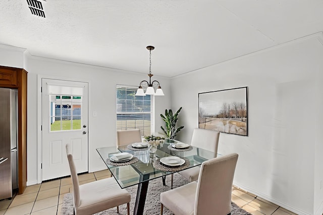 902 Church St, Sanger, TX 76266 - dining area with a chandelier and light tile patterned flooring