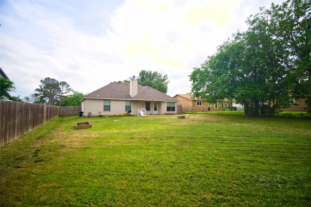 618 Matador Dr, Oak Point, TX 75068 - rear view of house featuring a chimney and an outdoor fire pit