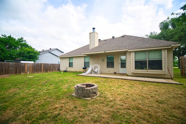 618 Matador Dr, Oak Point, TX 75068 - back of property with an outdoor fire pit, a chimney, a shingled roof, and a patio area
