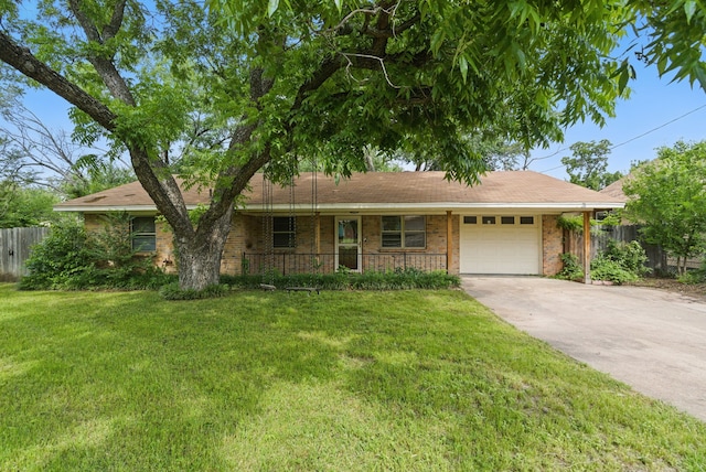 805 S Rusk St, Weatherford, TX 76086 - ranch-style house with an attached garage, concrete driveway, a porch, and brick siding