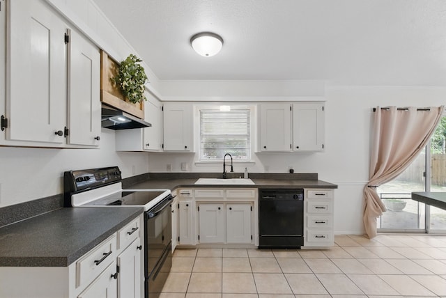 805 S Rusk St, Weatherford, TX 76086 - kitchen with range with electric cooktop, black dishwasher, a sink, and dark countertops